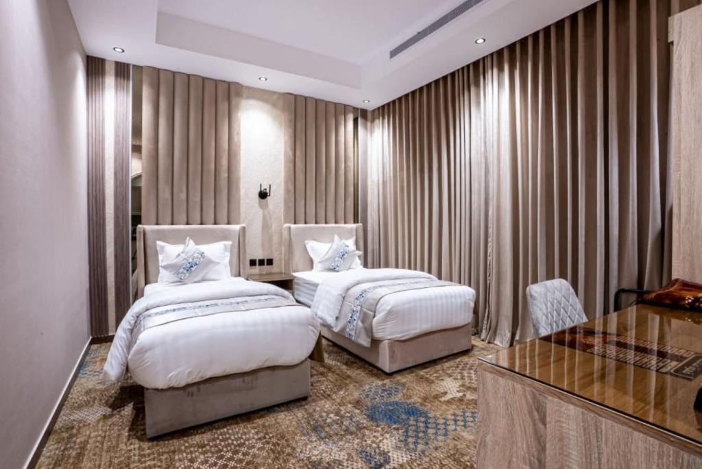 Letto o letti in una camera di نوران استار للشقق المخدومة