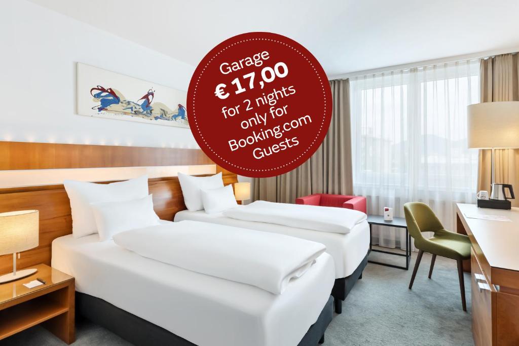 Una cama o camas en una habitación de Austria Trend Hotel Europa Graz Hauptbahnhof