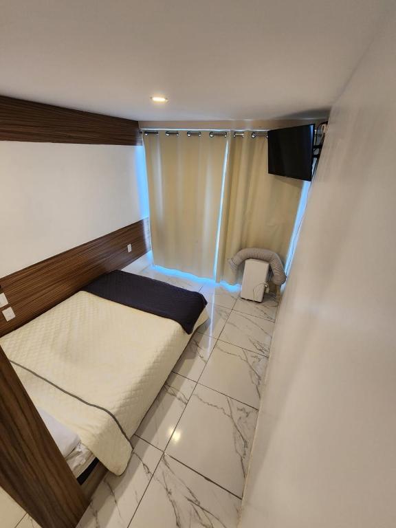 Voodi või voodid majutusasutuse Hotel Alambique Arandas toas