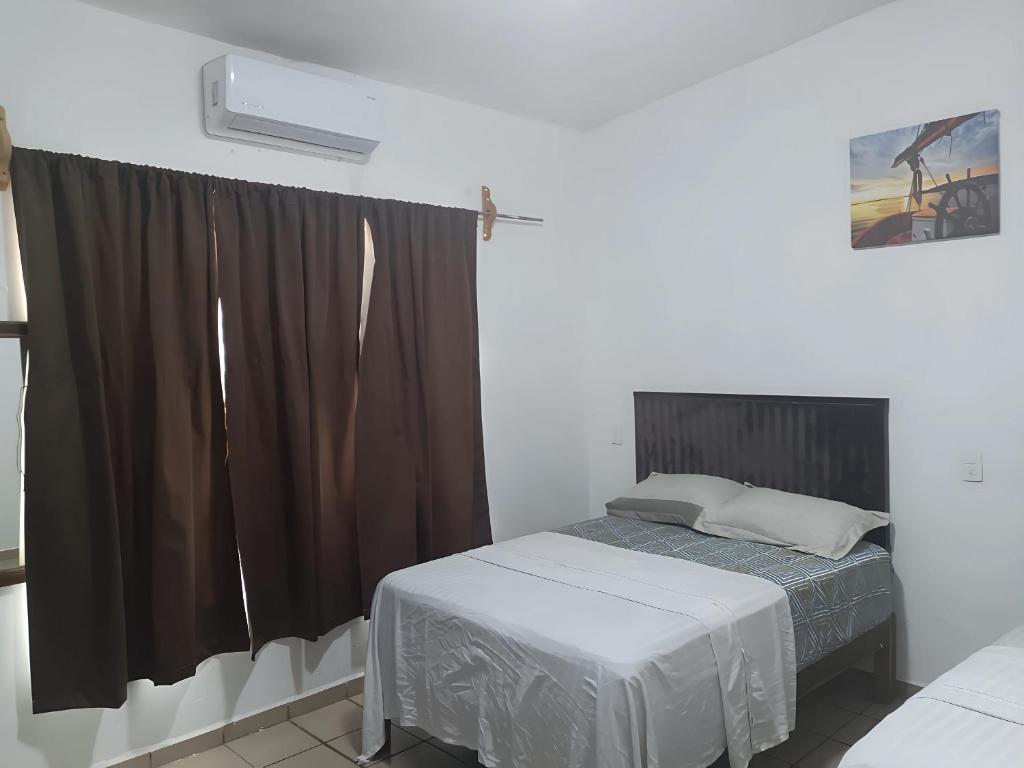 Postel nebo postele na pokoji v ubytování Centrico, seguro, buen precio, Timon