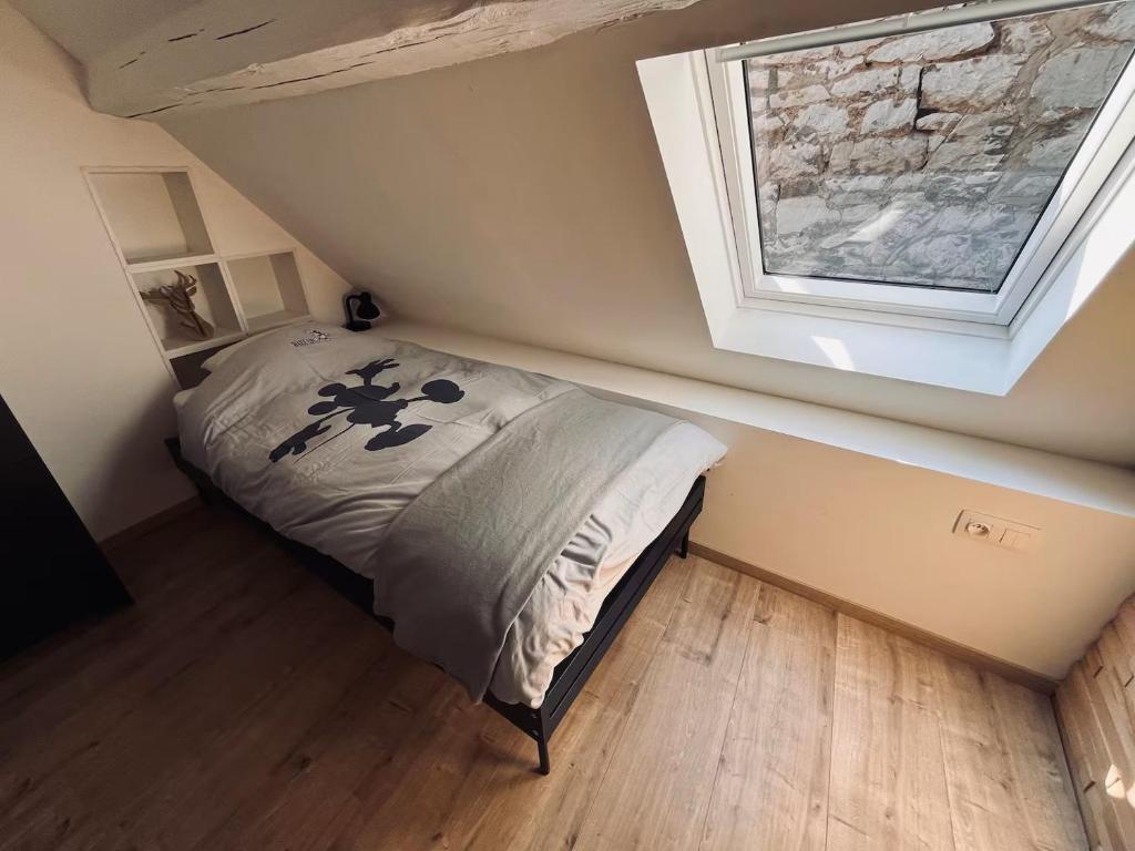 Postel nebo postele na pokoji v ubytování La maison Mythique