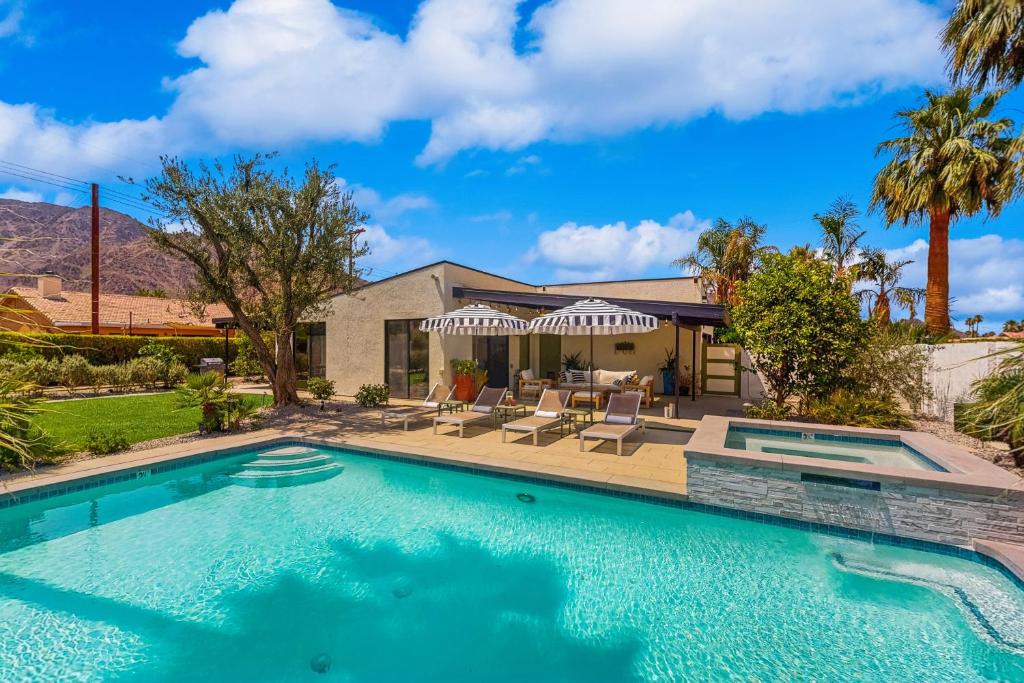 a swimming pool in front of a house at Jewel of the Desert 259-342 in La Quinta