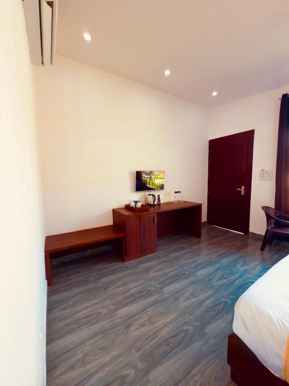 Postel nebo postele na pokoji v ubytování La Utopia Resort