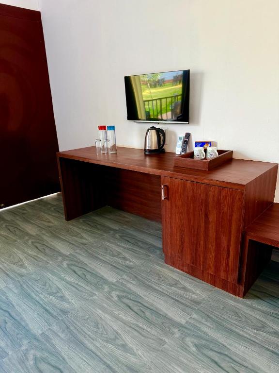 TV a/nebo společenská místnost v ubytování La Utopia Resort
