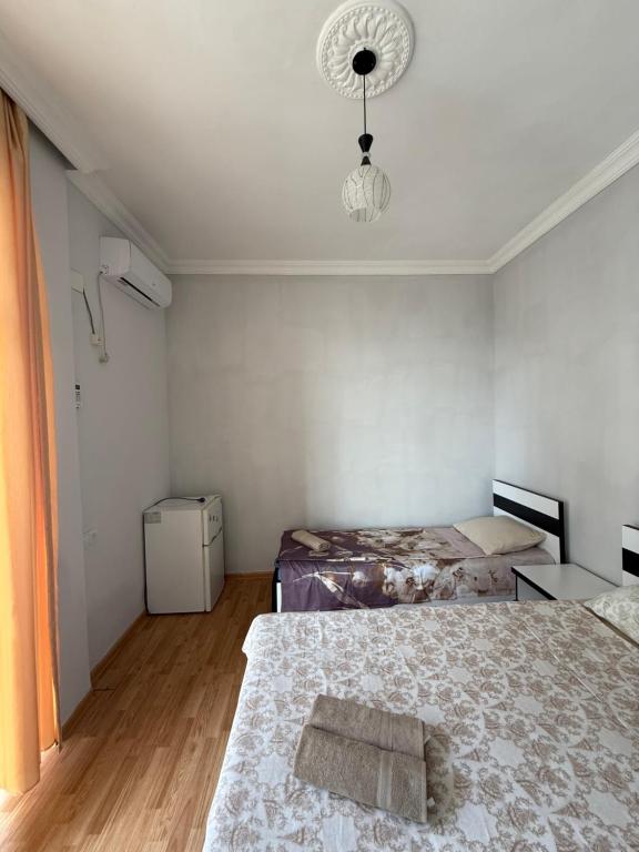 Postel nebo postele na pokoji v ubytování Temo's guest house in Kvariati