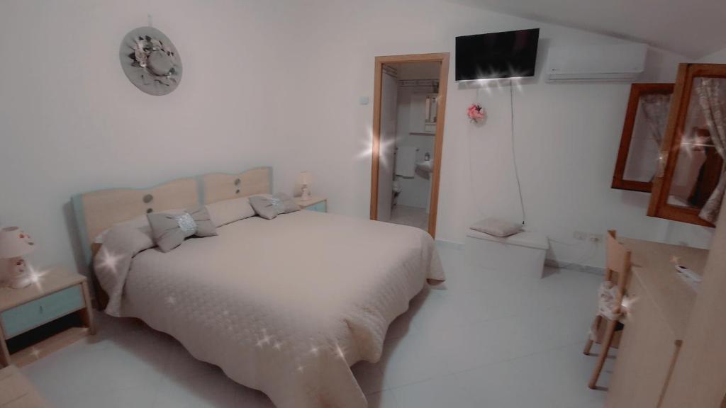 Postel nebo postele na pokoji v ubytování Hotel affittacamere novella