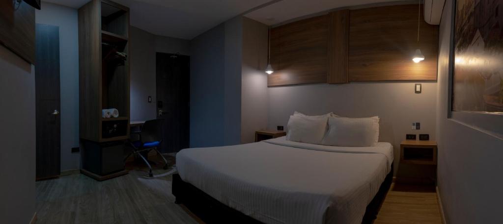 Postel nebo postele na pokoji v ubytování Hotel Blue Concept