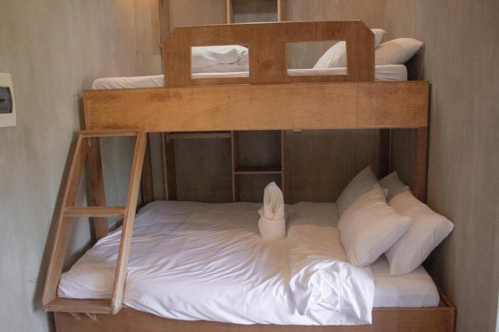 Postel nebo postele na pokoji v ubytování Ohayo Siargao