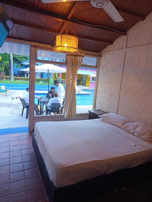 Postel nebo postele na pokoji v ubytování Hotel Palma Paraíso