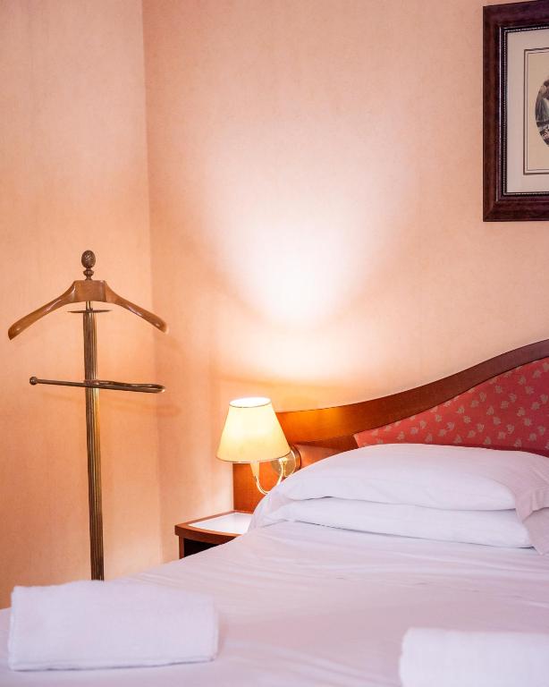 Posteľ alebo postele v izbe v ubytovaní Massimo Plaza Hotel