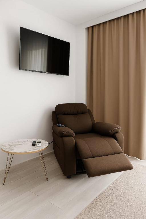 TV a/nebo společenská místnost v ubytování Vila AMAZON