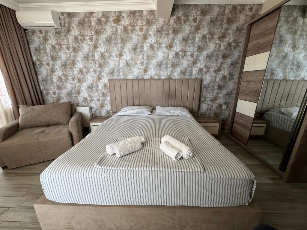 Postel nebo postele na pokoji v ubytování Karo Hotel