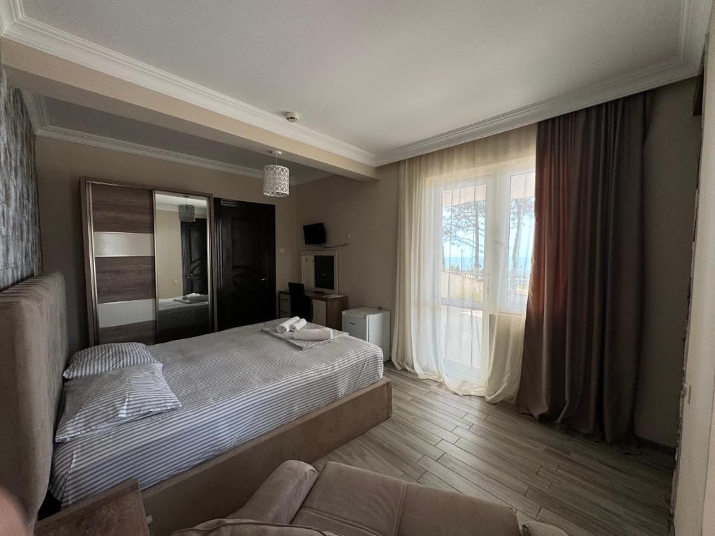 Postel nebo postele na pokoji v ubytování Karo Hotel