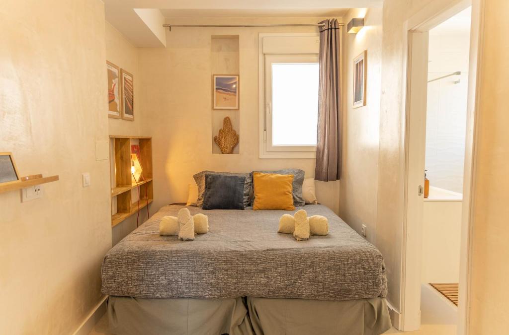 Postel nebo postele na pokoji v ubytování Tarifa Cozy House - Old Surf