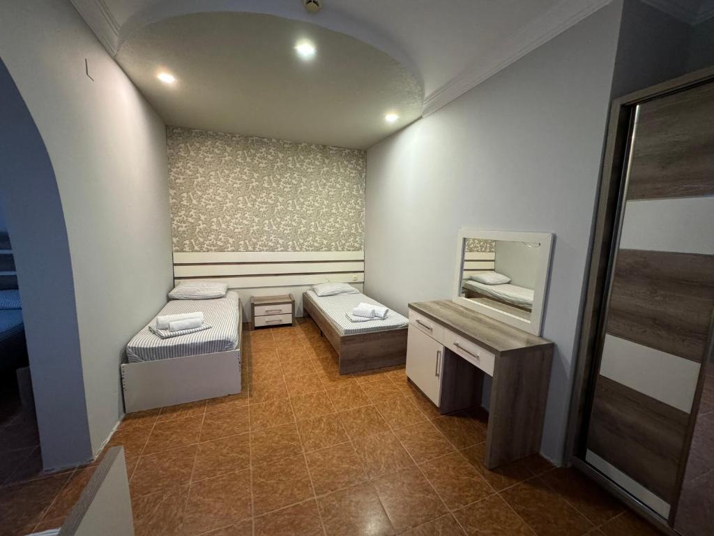 Postel nebo postele na pokoji v ubytování Karo Hotel