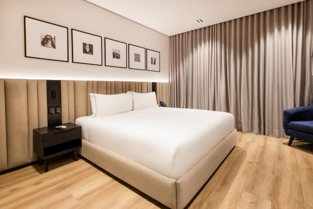 Postel nebo postele na pokoji v ubytování Vuestro Hotel Boutique