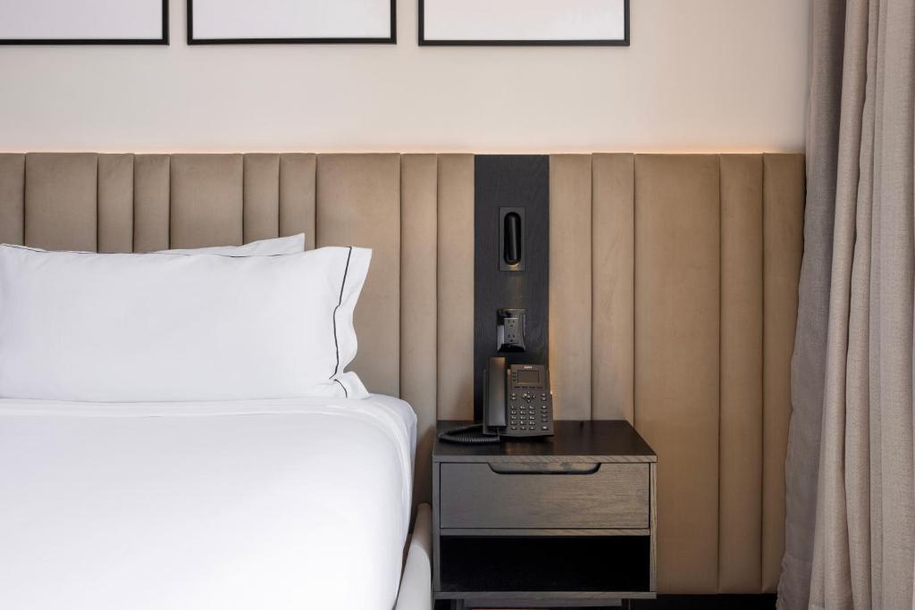 Postel nebo postele na pokoji v ubytování Vuestro Hotel Boutique