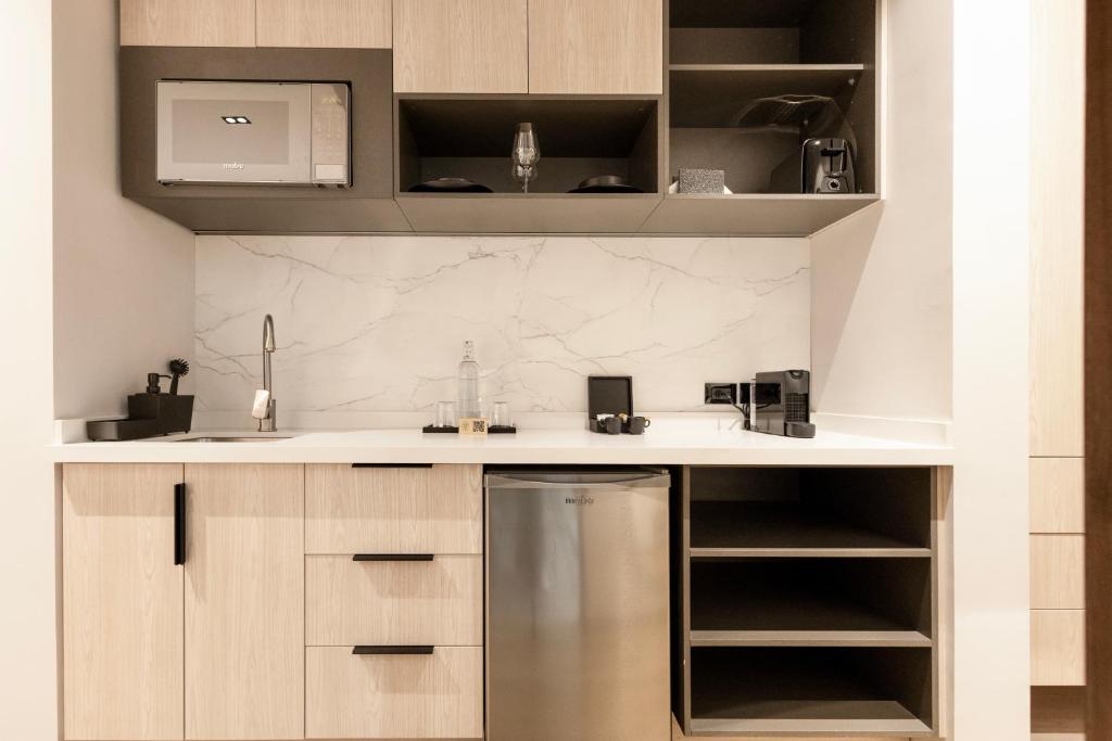 Kuchyň nebo kuchyňský kout v ubytování Vuestro Hotel Boutique