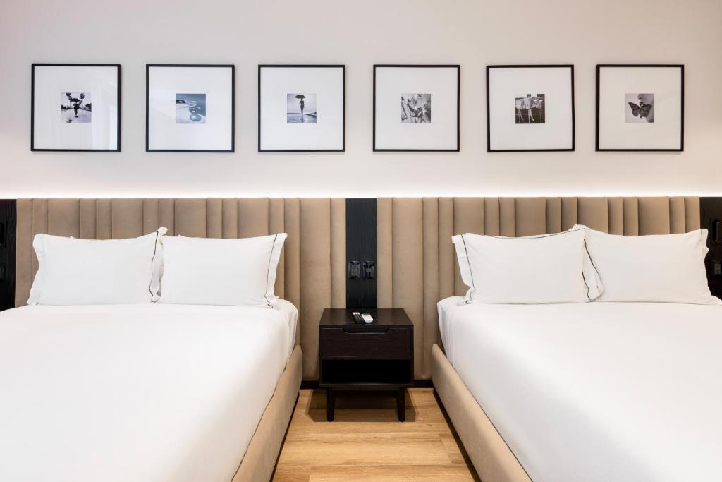 Postel nebo postele na pokoji v ubytování Vuestro Hotel Boutique
