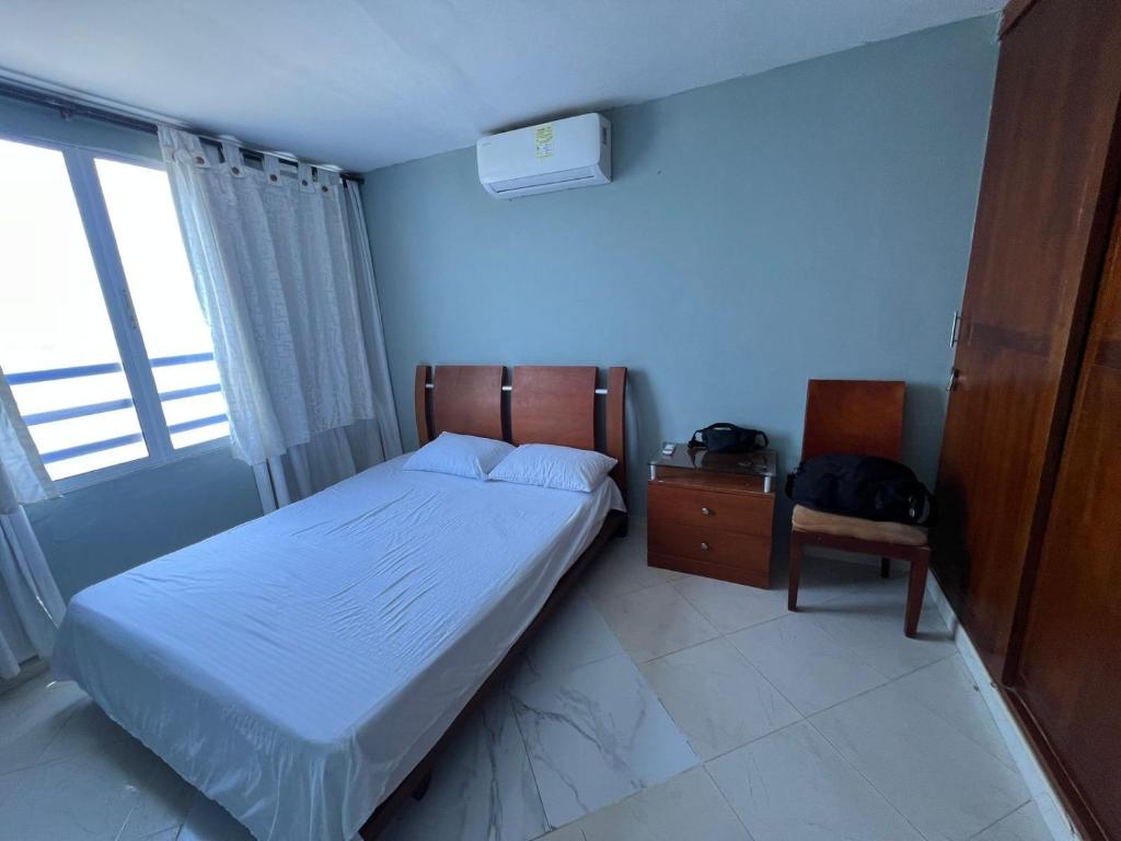 Postel nebo postele na pokoji v ubytování Bahía Caribe