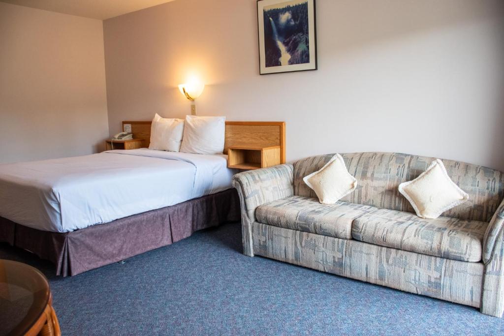Postel nebo postele na pokoji v ubytování Ace Western Motel