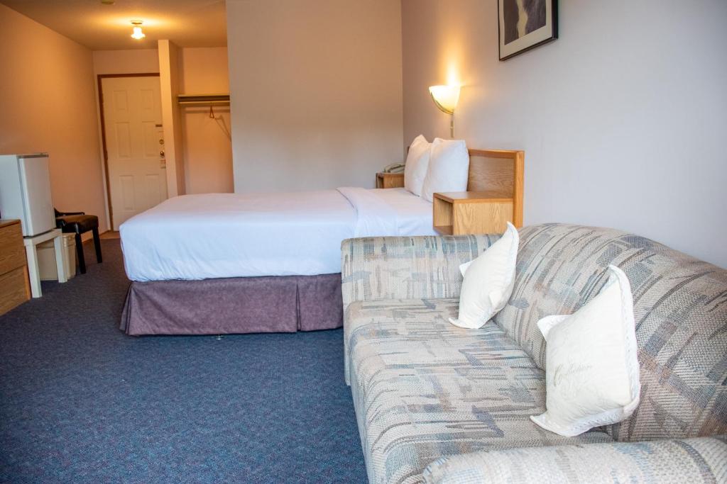 Postel nebo postele na pokoji v ubytování Ace Western Motel