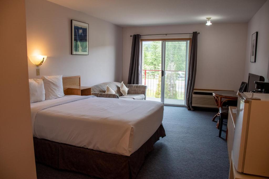 Postel nebo postele na pokoji v ubytování Ace Western Motel