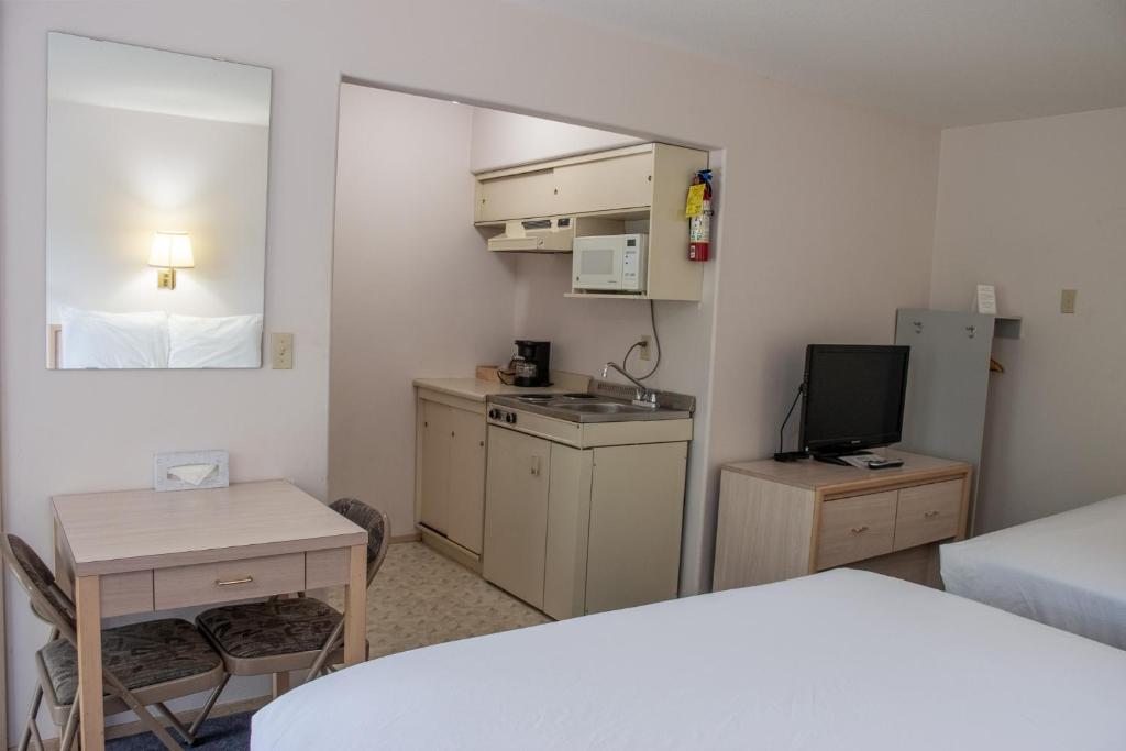 Kuchyň nebo kuchyňský kout v ubytování Ace Western Motel