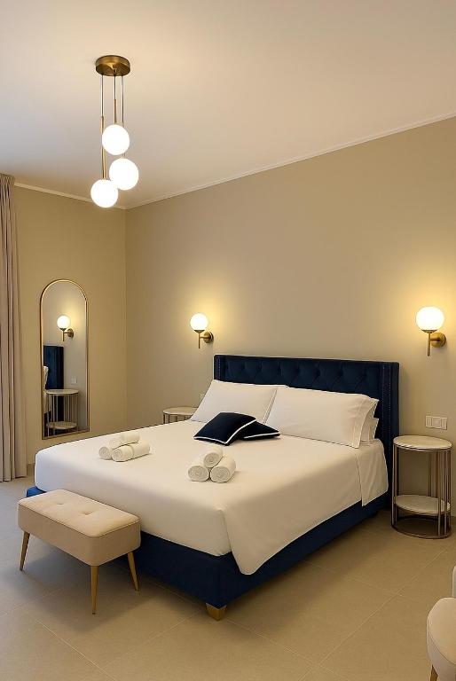 Postel nebo postele na pokoji v ubytování Maison ì room & suites