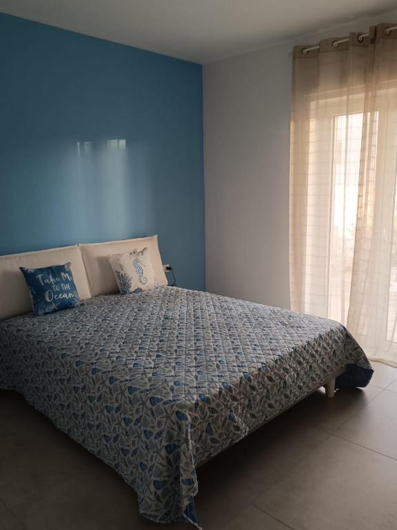 Ένα ή περισσότερα κρεβάτια σε δωμάτιο στο Casa Nonna Marì