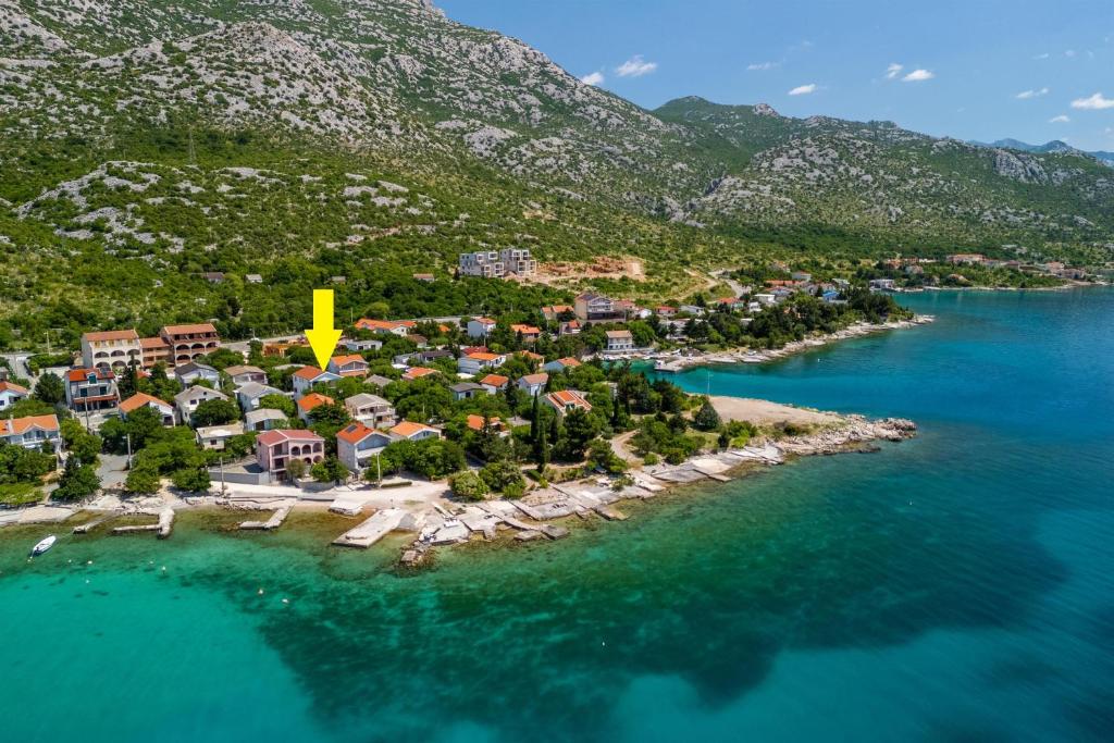 an aerial view of a small island in the water at Apartments Bono in Karlobag
