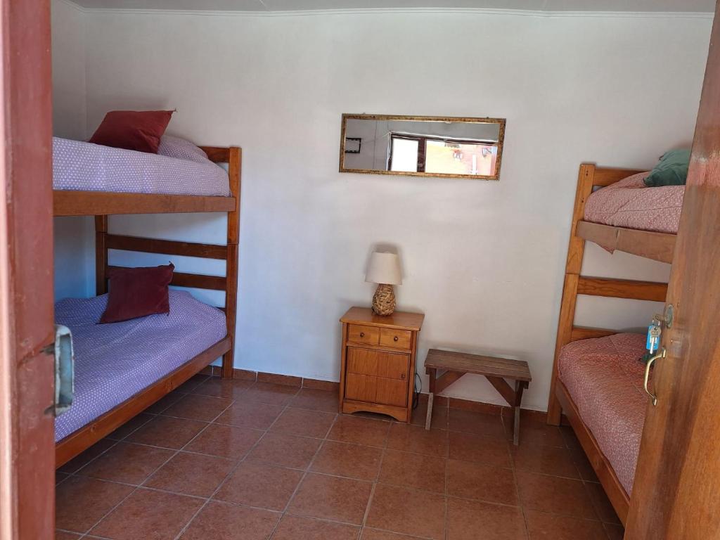 Postel nebo postele na pokoji v ubytování Hostal Las Kañas
