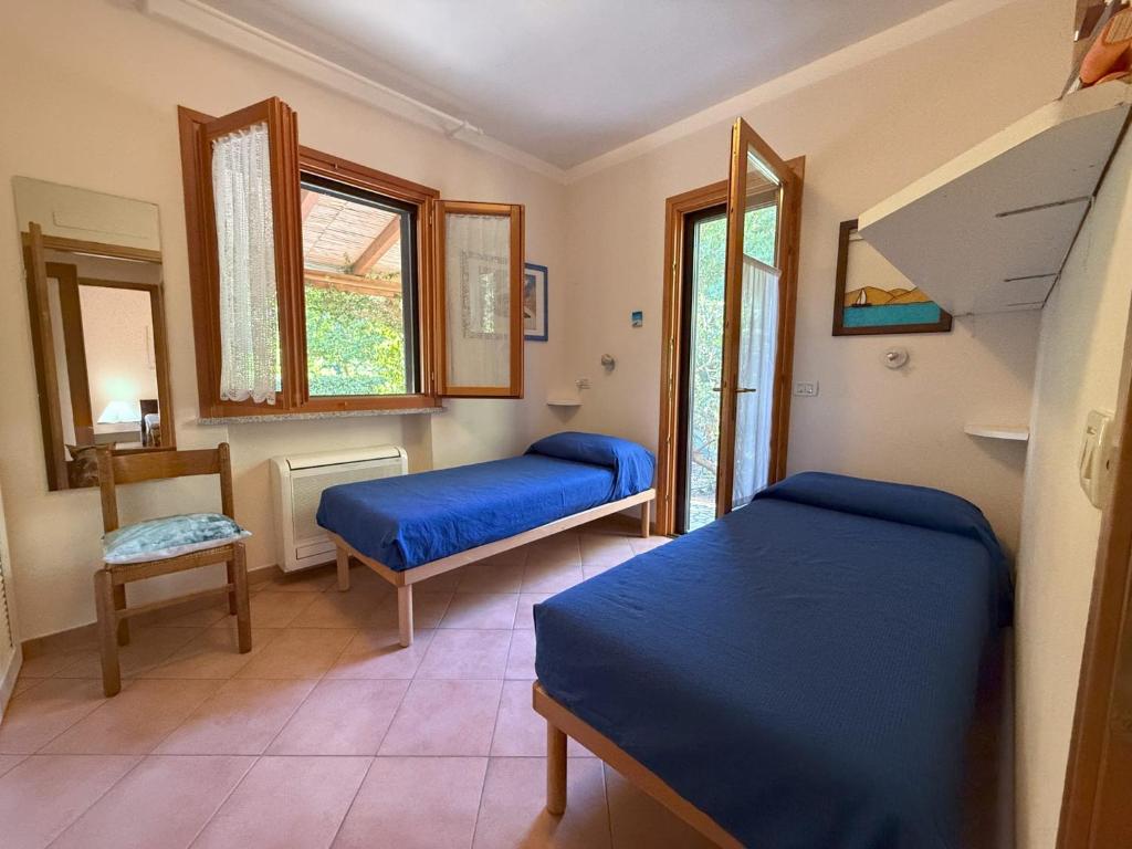 Postel nebo postele na pokoji v ubytování Lentisco terra e mare
