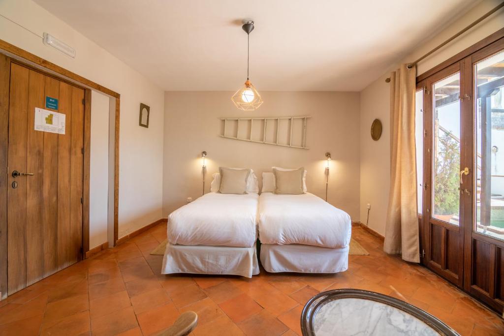Postel nebo postele na pokoji v ubytování Casa Bombo