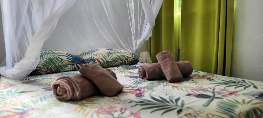 Postel nebo postele na pokoji v ubytování Katy kate, Pointe du bout, Les Trois-Îlets