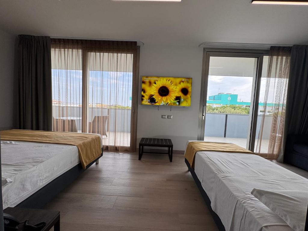 Postel nebo postele na pokoji v ubytování HOTEL VENICE BEACH HVB 34 Lifestyle 4 Superior