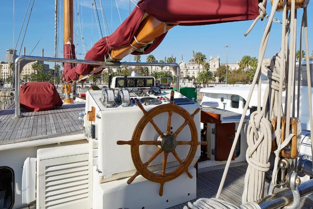 a boat with a steering wheel on the deck at Southern Cross in Barcelona