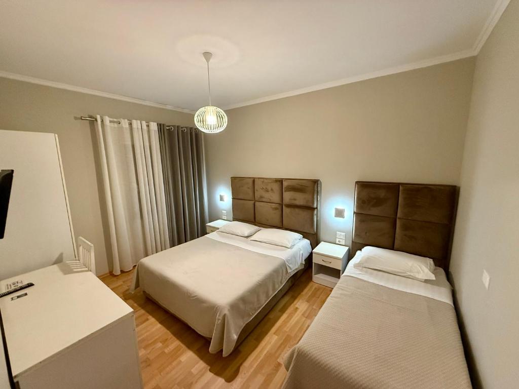 Voodi või voodid majutusasutuse Rooms Dionis toas