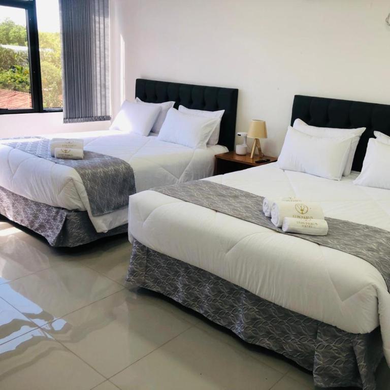 Postel nebo postele na pokoji v ubytování Hotel Luis Pablo