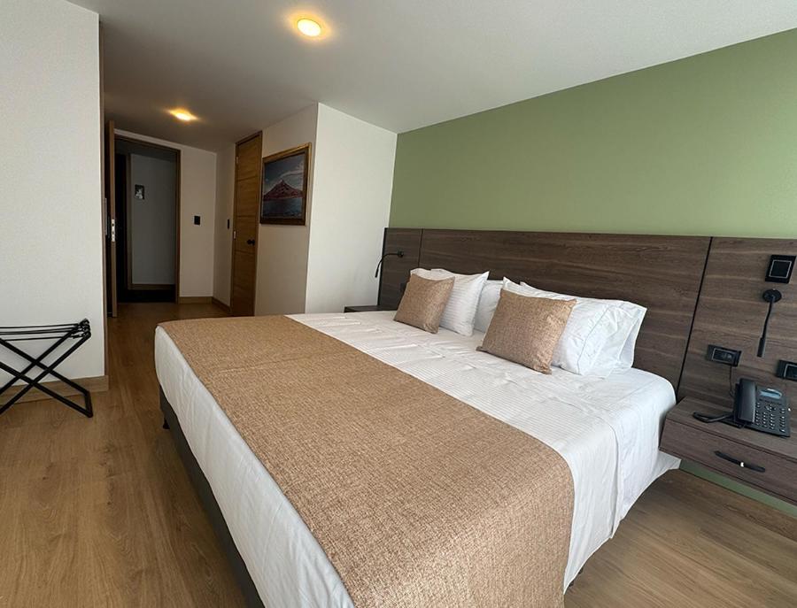 Postel nebo postele na pokoji v ubytování Entrenevados Hotel