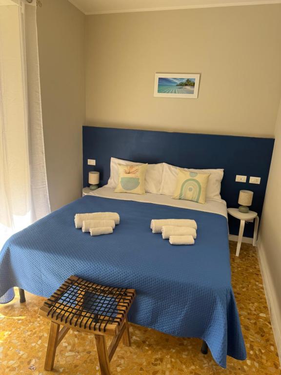 Ένα ή περισσότερα κρεβάτια σε δωμάτιο στο Roma Ostia Vacanze Romane Inn