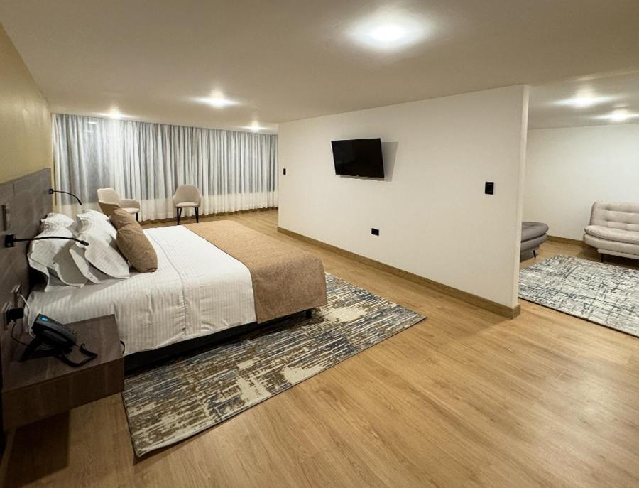 Postel nebo postele na pokoji v ubytování Entrenevados Hotel