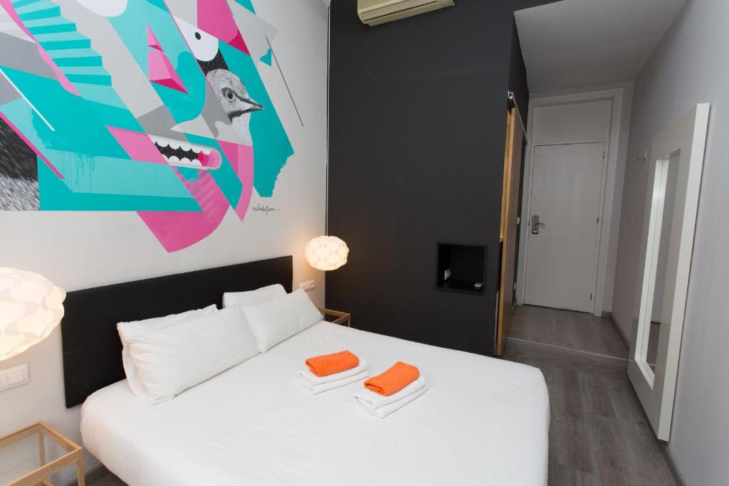 Postel nebo postele na pokoji v ubytování ZOOROOMS Boutique Guesthouse