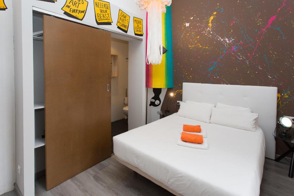 Postel nebo postele na pokoji v ubytování ZOOROOMS Boutique Guesthouse