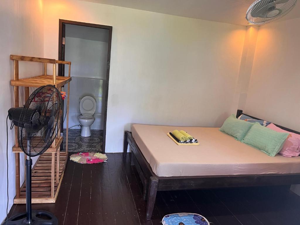 Postel nebo postele na pokoji v ubytování BaleCabugaoCottagesRental