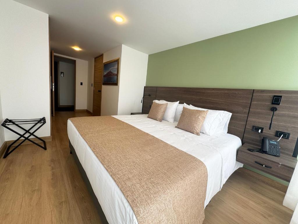 Postel nebo postele na pokoji v ubytování Entrenevados Hotel