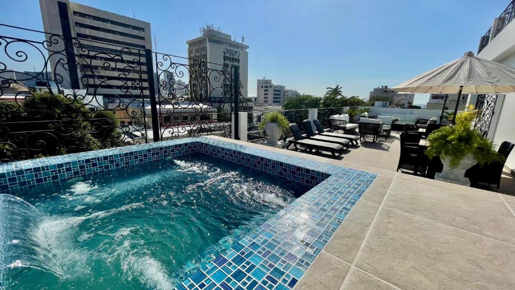 a swimming pool on top of a building at Azure apartahotel in Santa Marta