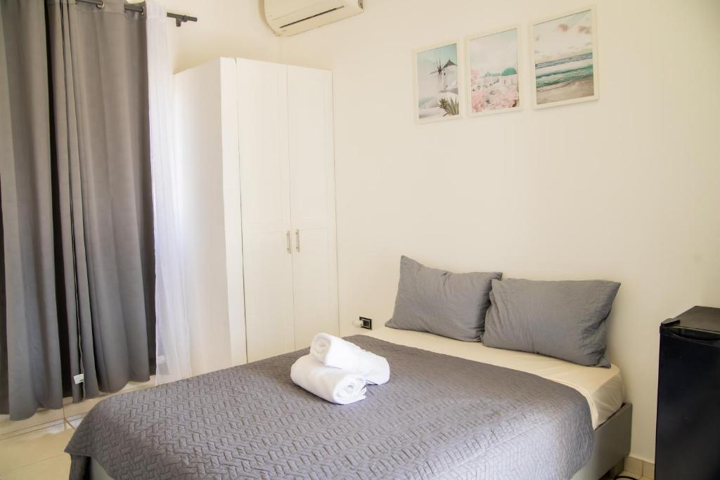 Postel nebo postele na pokoji v ubytování Hotel Casa Pierretta