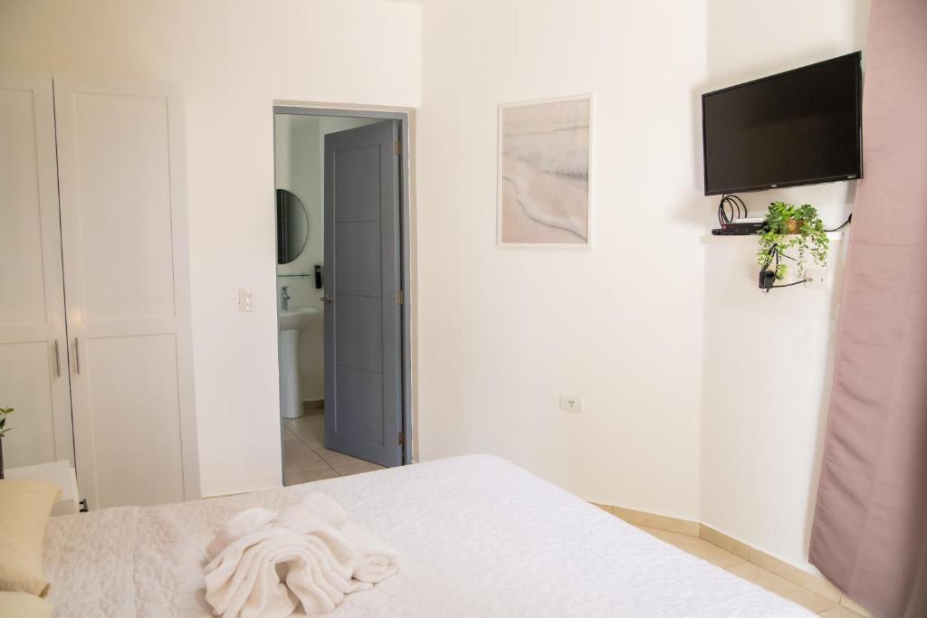Postel nebo postele na pokoji v ubytování Hotel Casa Pierretta