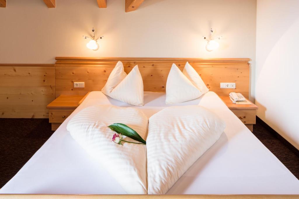 Postel nebo postele na pokoji v ubytování Hotel Wieslhof